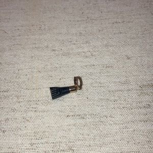 14kt gold black azabache charm.